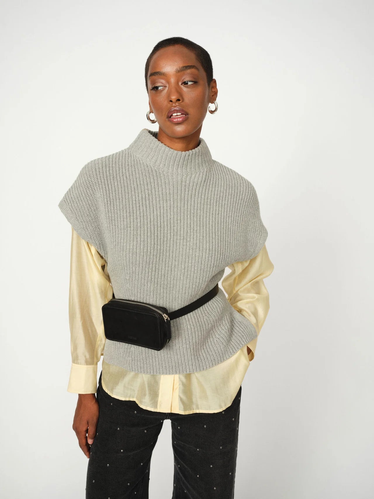 Close-up of soft ribbed knit texture on grey Mos Mosh vest