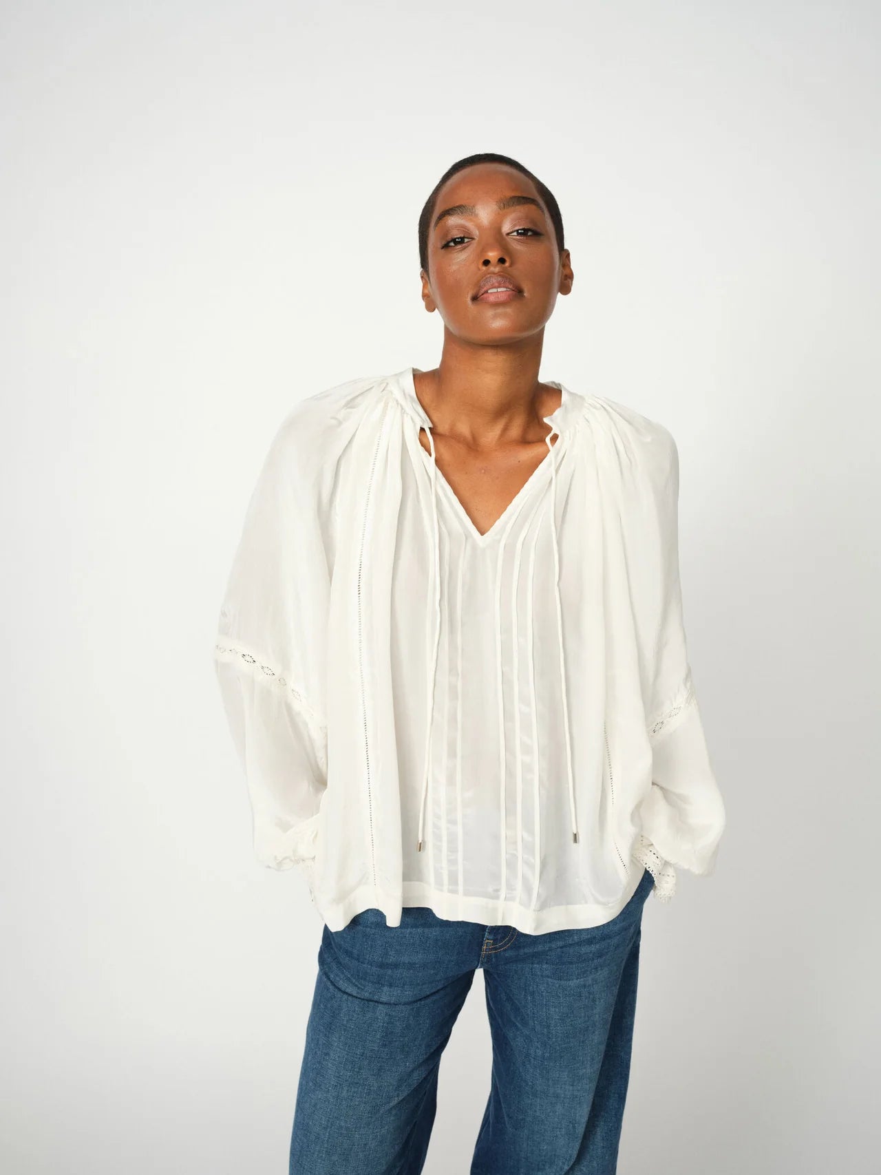 Model wearing Mos Mosh Loose Fit Vuela white blouse with pintuck detailing