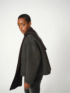 Side view of Mos Mosh Loisa charcoal wool jacket showing cropped, boxy silhouette.