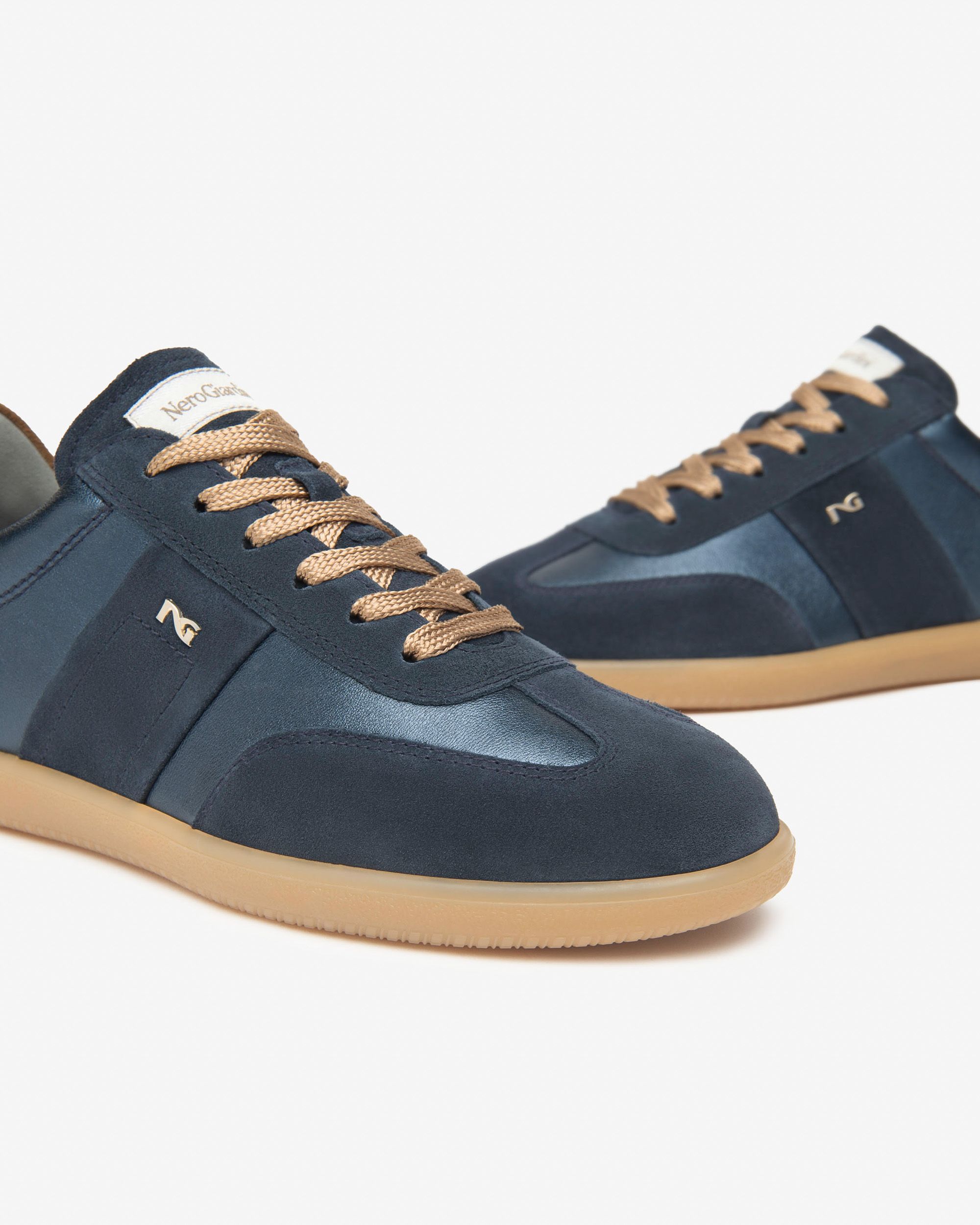 NeroGiardini Italian trainers with tan sole and navy upper – full pair front view