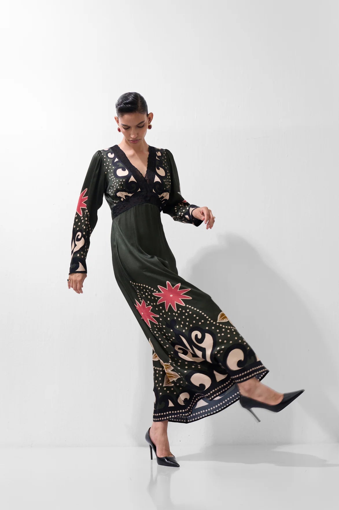 NOIB Aura Nocturnal Jungle botanical print maxi dress showing flowing skirt and patterned hem – movement view.