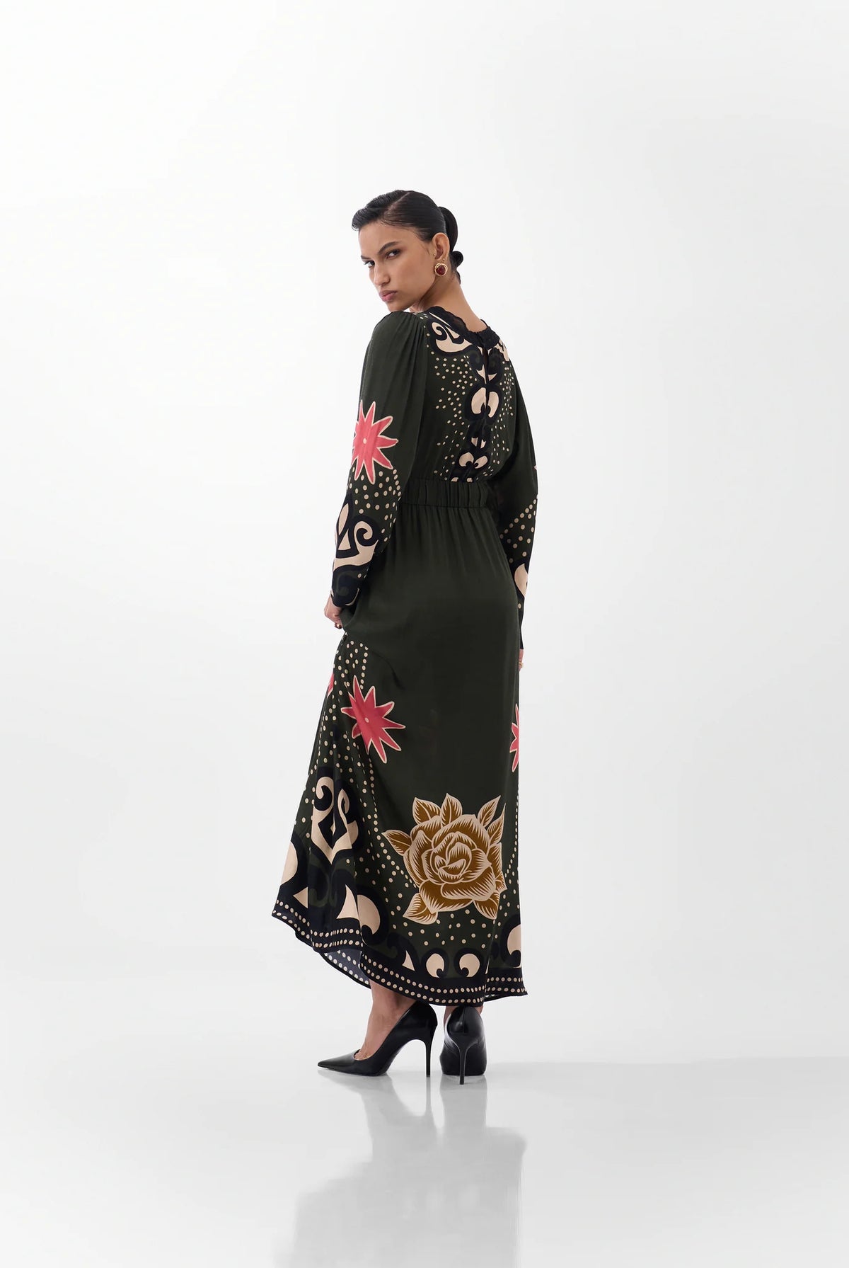 NOIB Aura Nocturnal Jungle printed maxi dress showing botanical motifs across the sleeves and back – rear view.