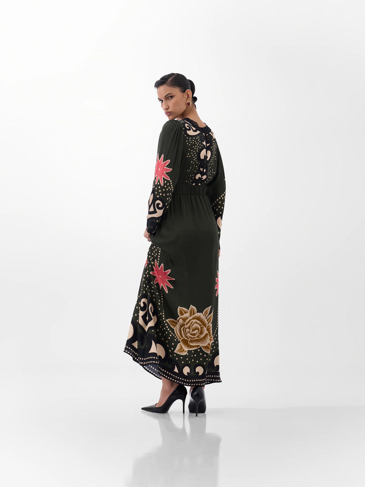 NOIB Aura Nocturnal Jungle printed maxi dress showing botanical motifs across the sleeves and back – rear view.