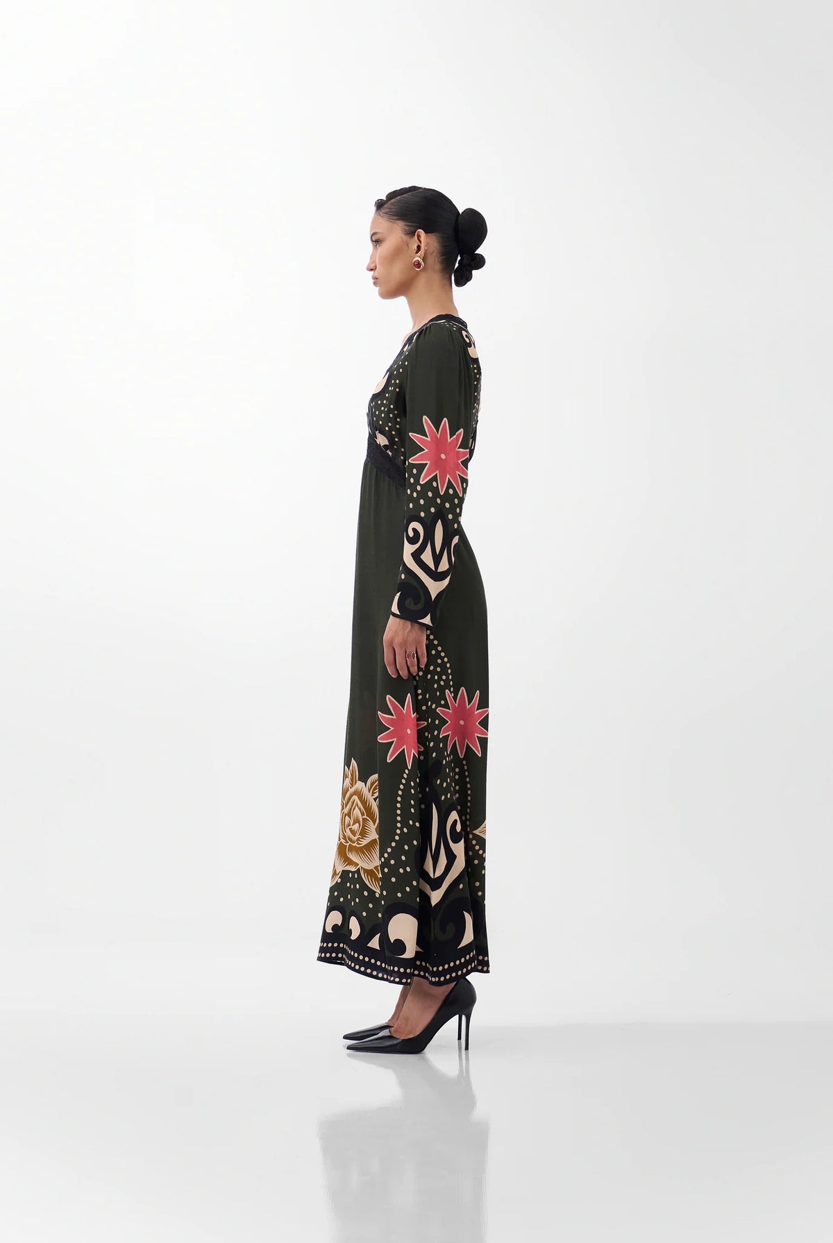 NOIB Aura Old Rose long sleeve printed maxi dress with flowing skirt – side profile view.