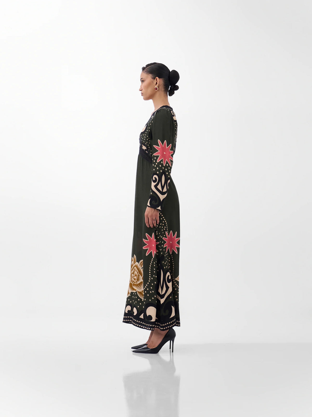 NOIB Aura Old Rose long sleeve printed maxi dress with flowing skirt – side profile view.