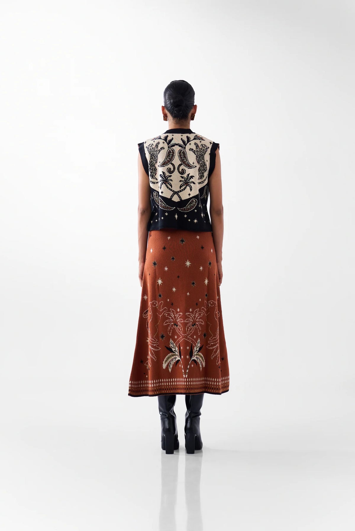 NOIB Lola black and ivory patterned knitted waistcoat with tropical back design – rear outfit view.