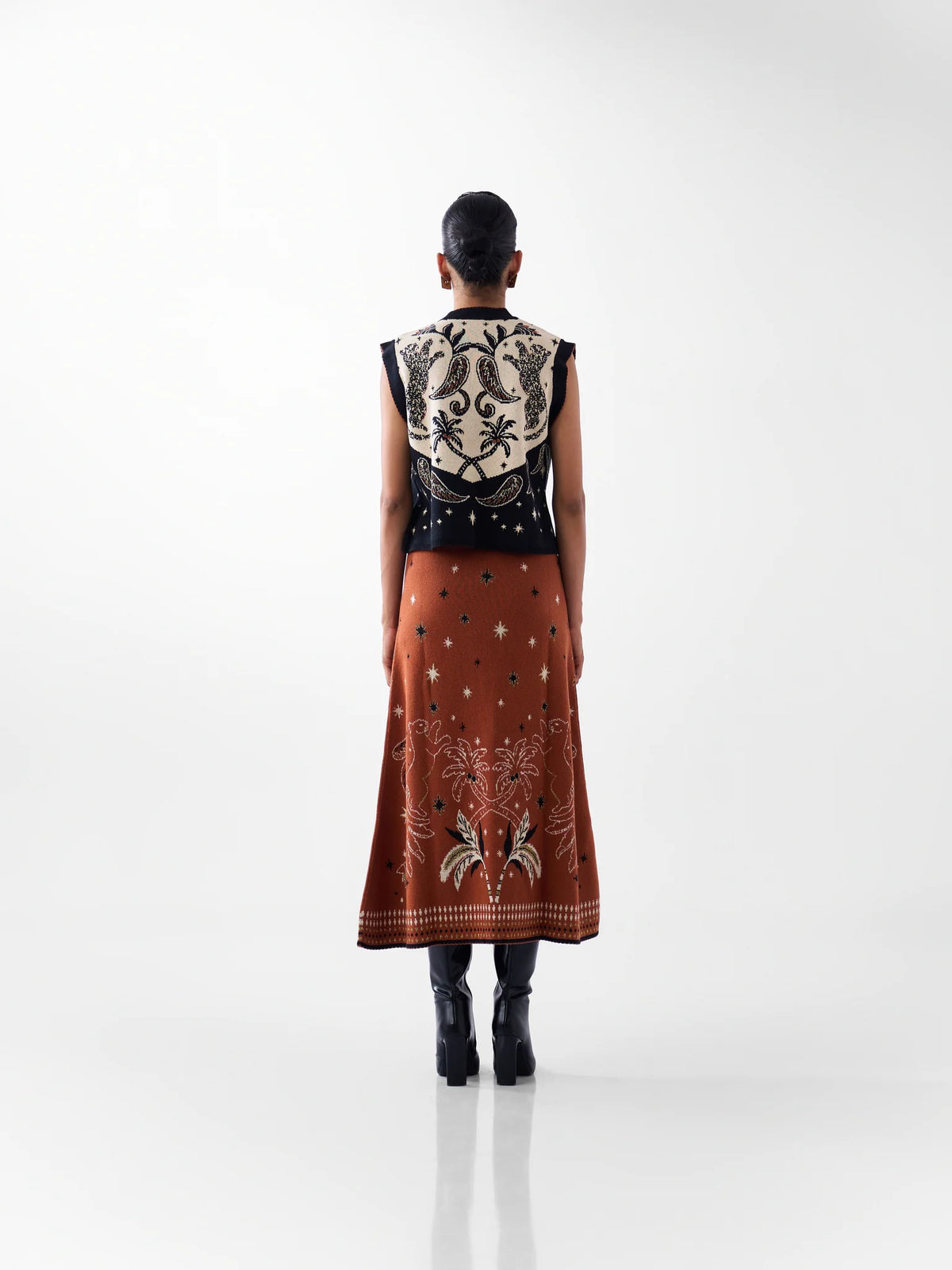 NOIB Lola black and ivory patterned knitted waistcoat with tropical back design – rear outfit view.