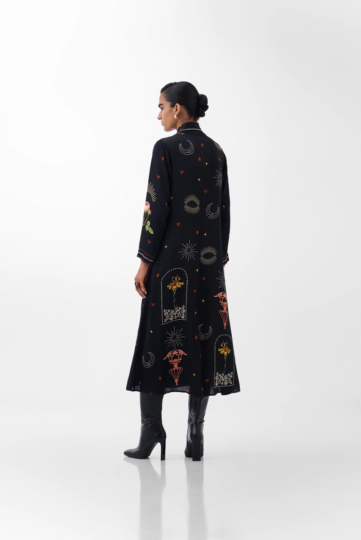 NOIB Willow black printed maxi dress showing decorative motifs across the back – rear model view