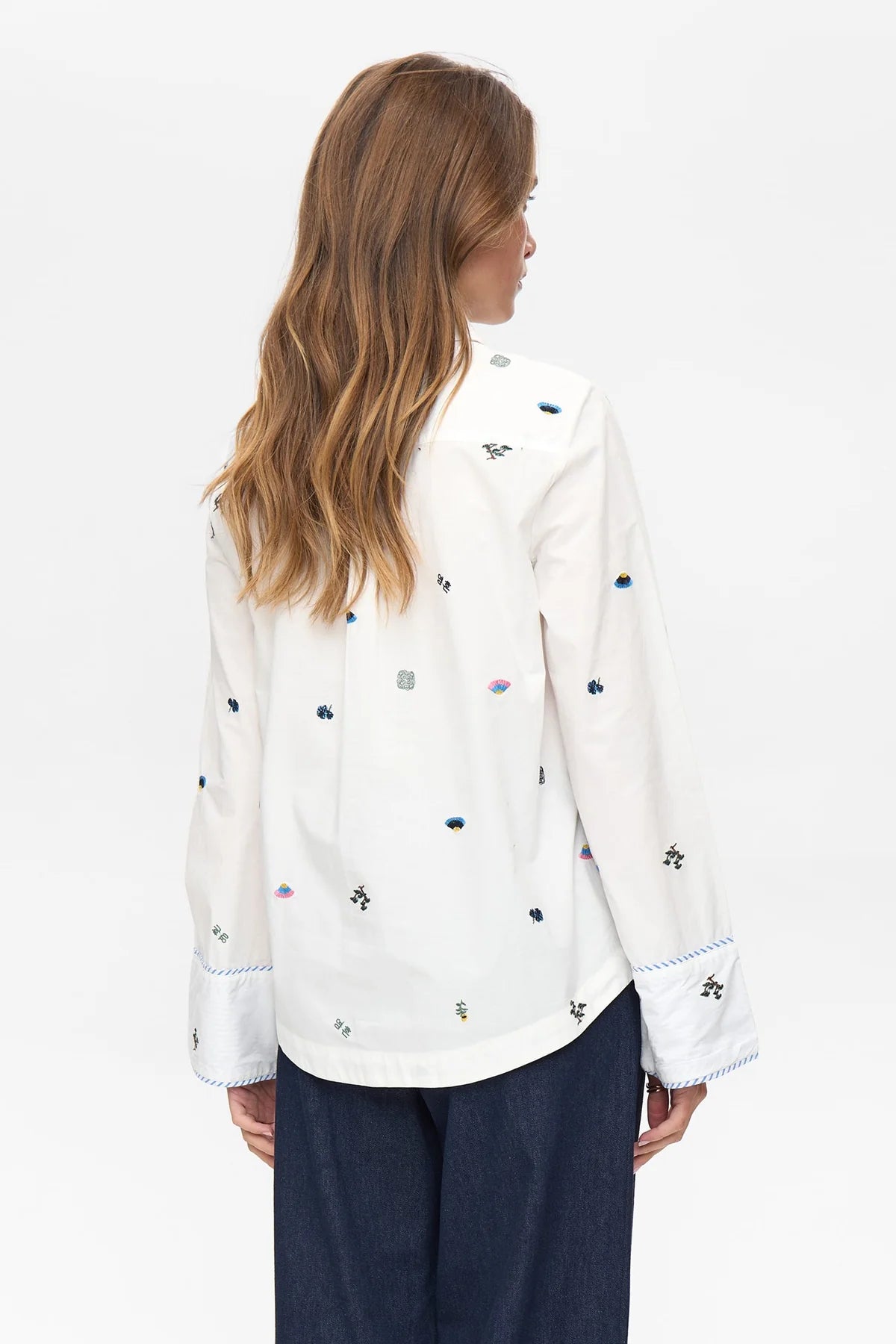 Back view of Numph Nuchiro embroidered cotton shirt with scattered motifs.