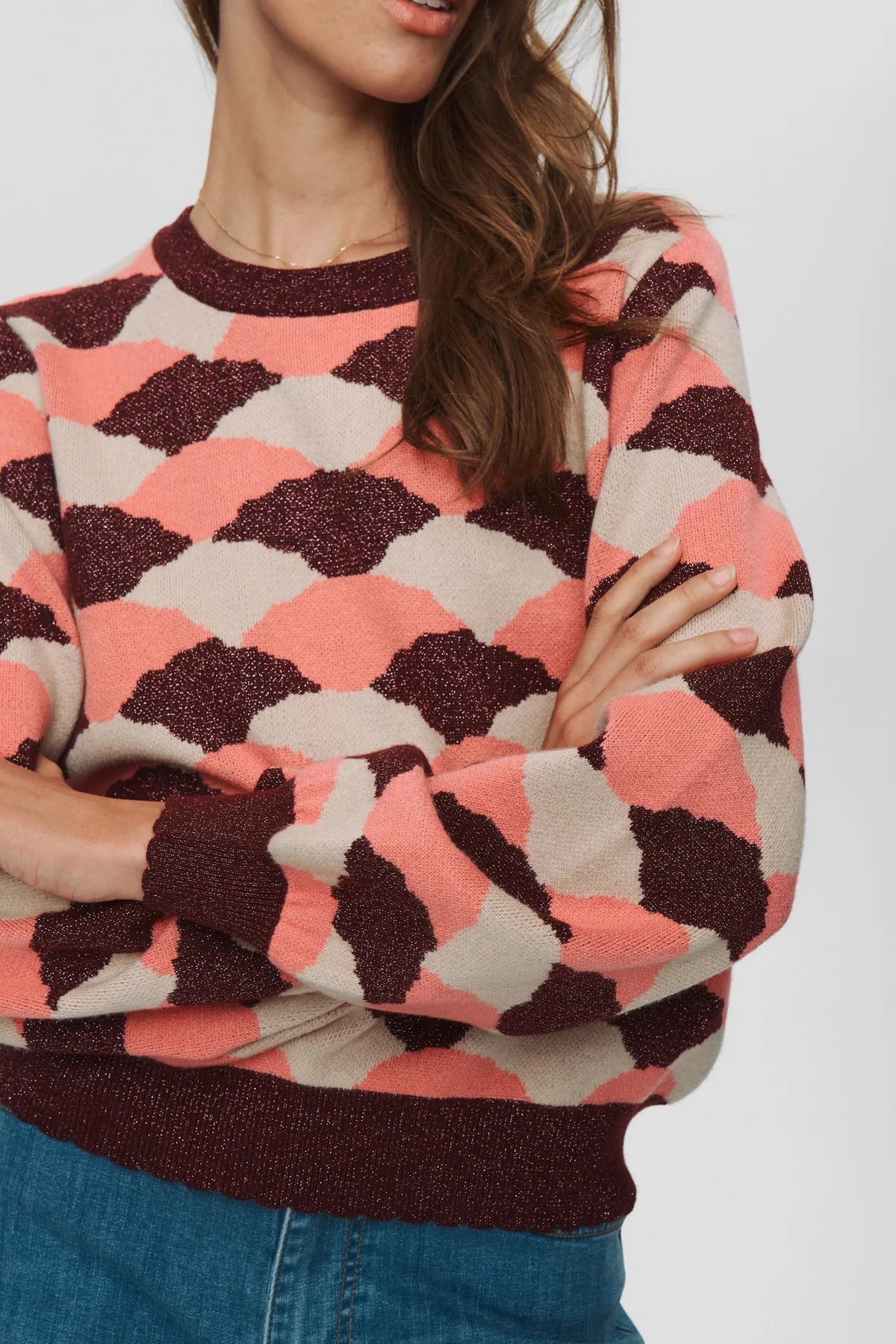 Close-up of Numph Nulila metallic thread detail in geometric pink knit For women