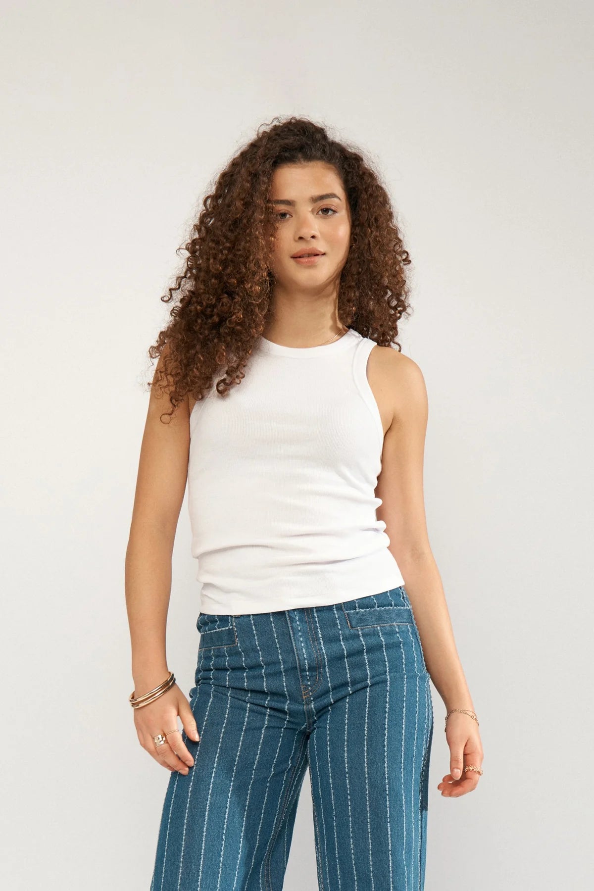 Numph fitted sleeveless vest top front styled with jeans