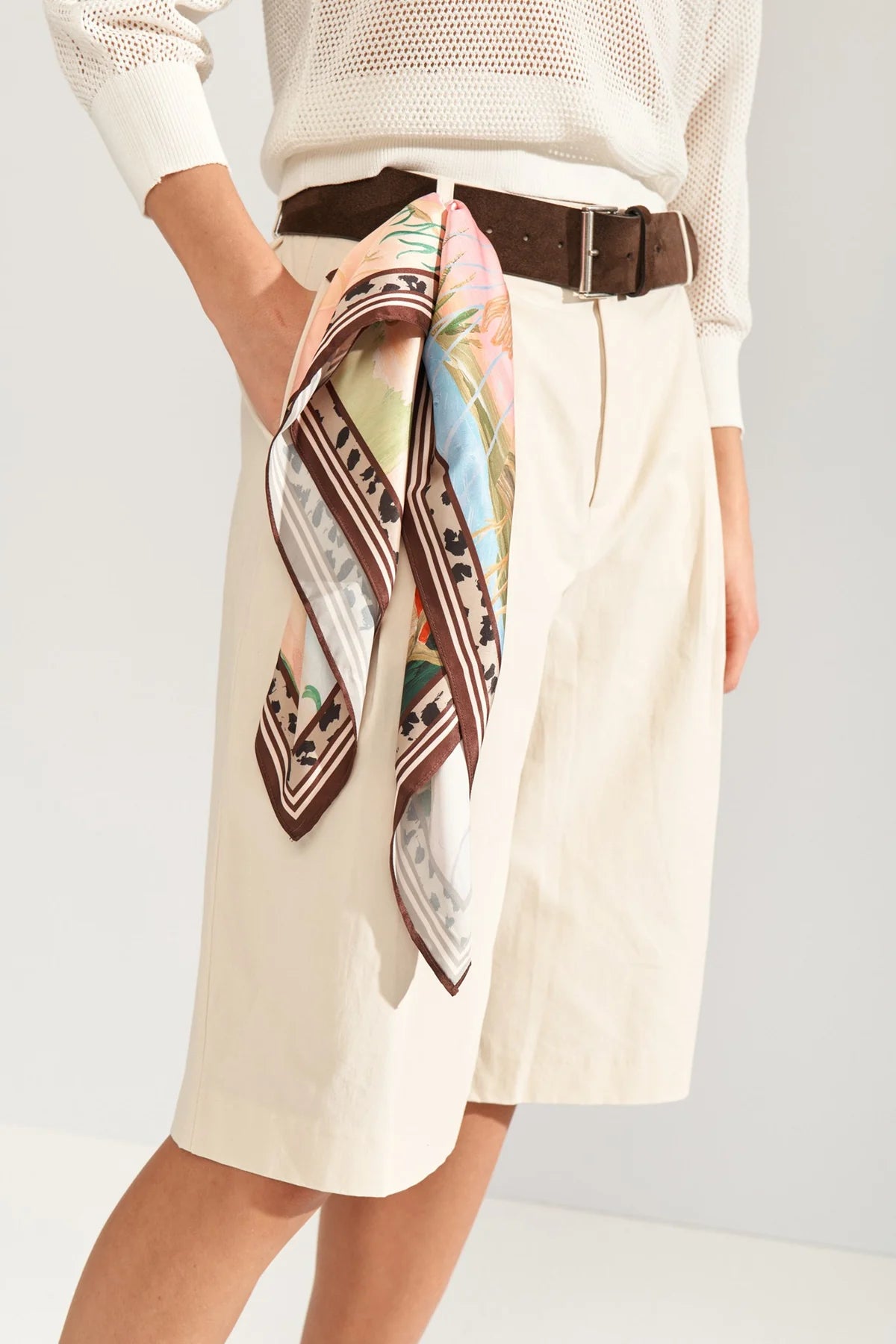 Numph printed scarf styled around a belt