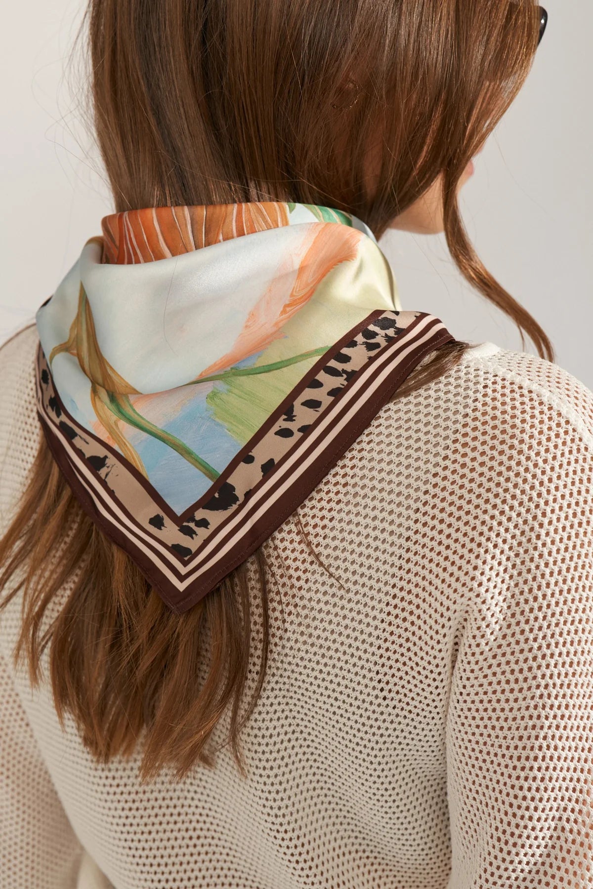Numph printed scarf styled around neck back view