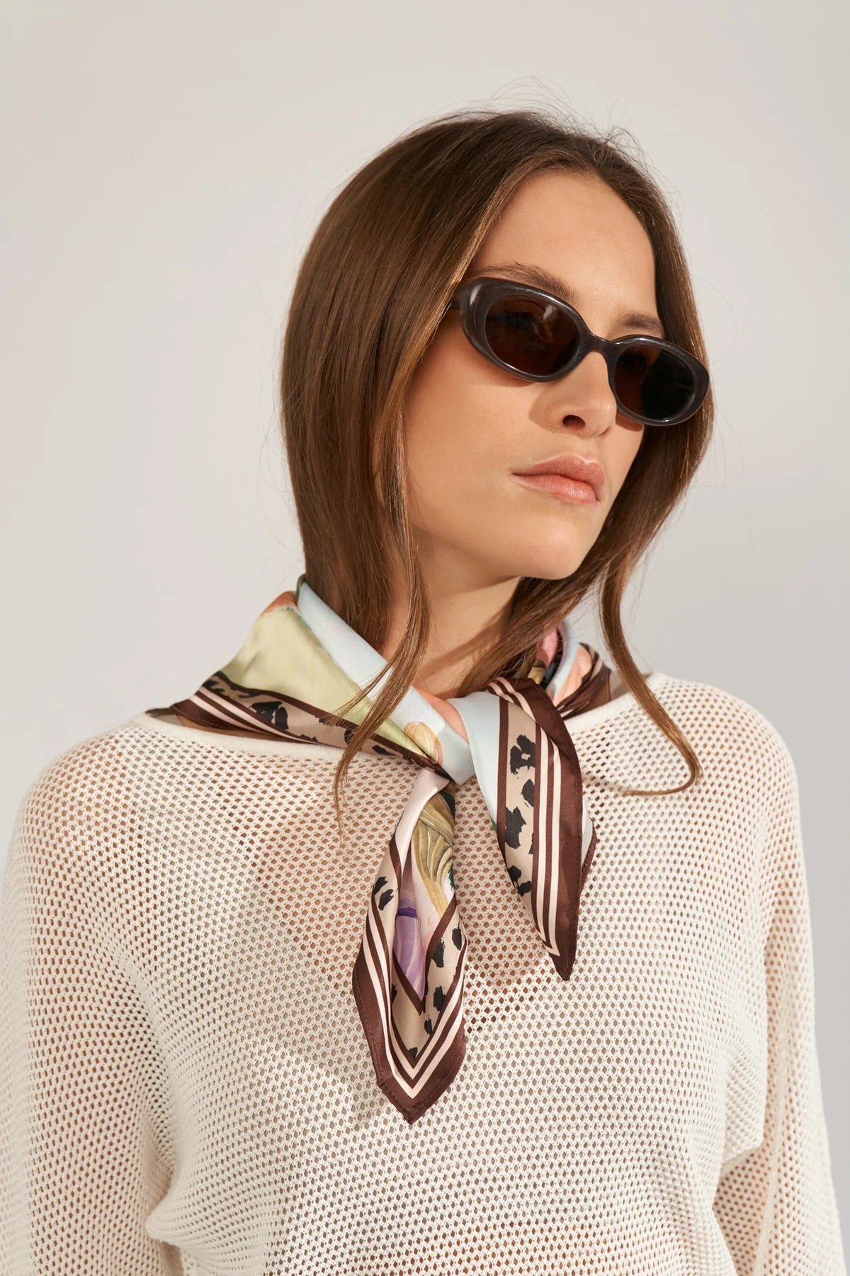 Numph printed scarf styled around neck