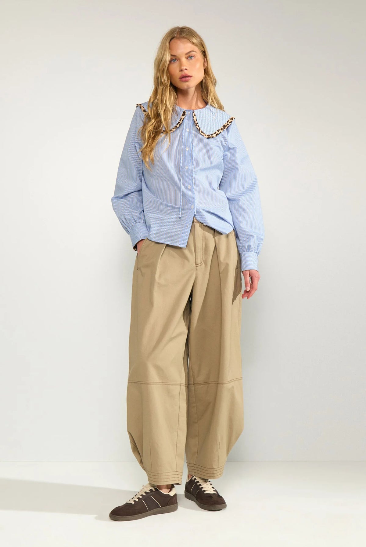 Nümph Numayana blue striped shirt styled with tan wide-leg trousers – full outfit view