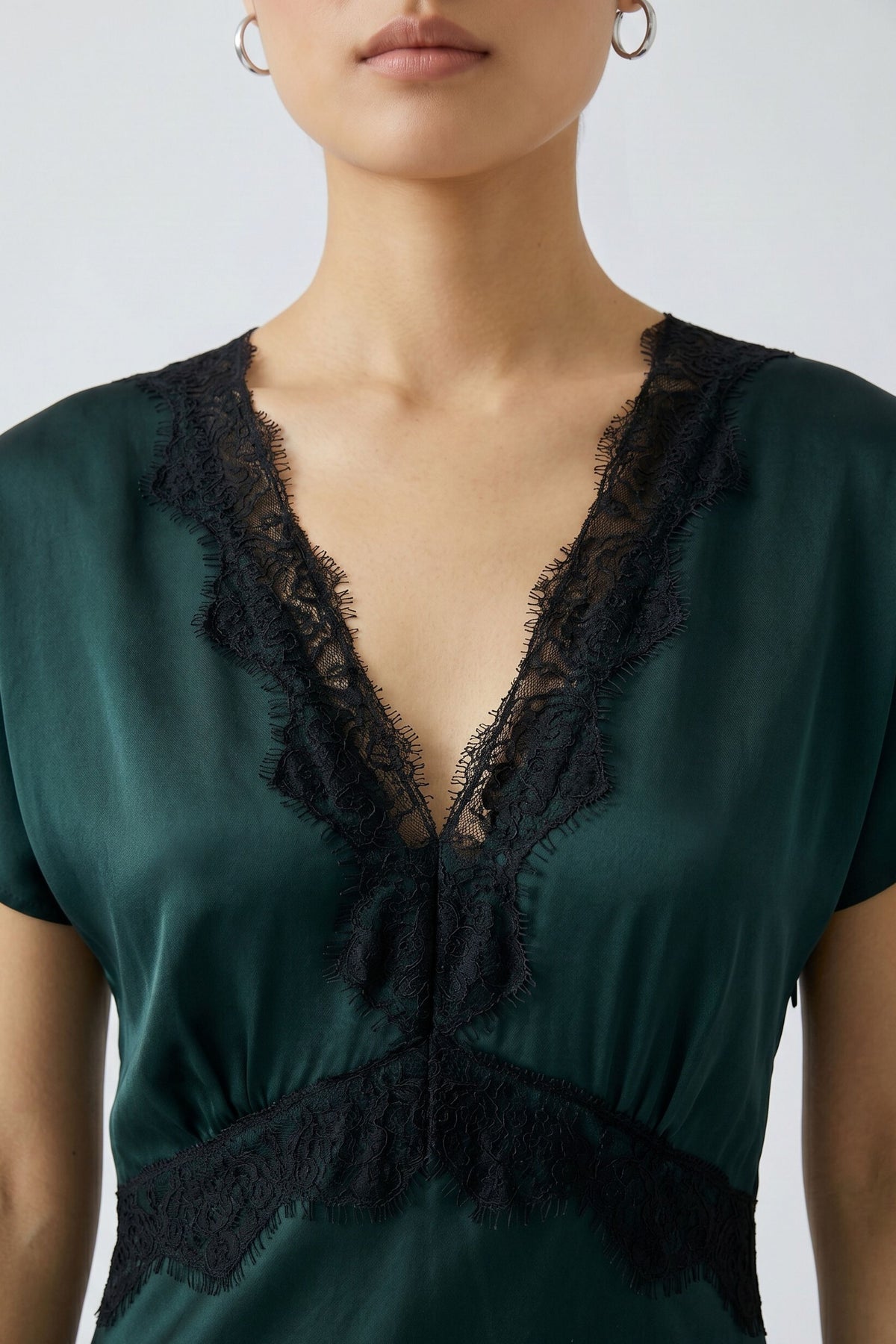Oui green satin midi dress with black lace V-neck trim – neckline close-up