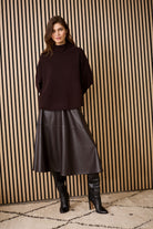 Oui chocolate faux-leather A-line midi skirt — styled with knit and boots