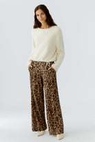 Model wearing Oui ecru bouclé jumper with drawstring hem, front view.