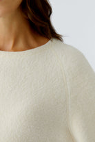 Oui 88291 Close-up of bouclé knit texture and crew neckline.
