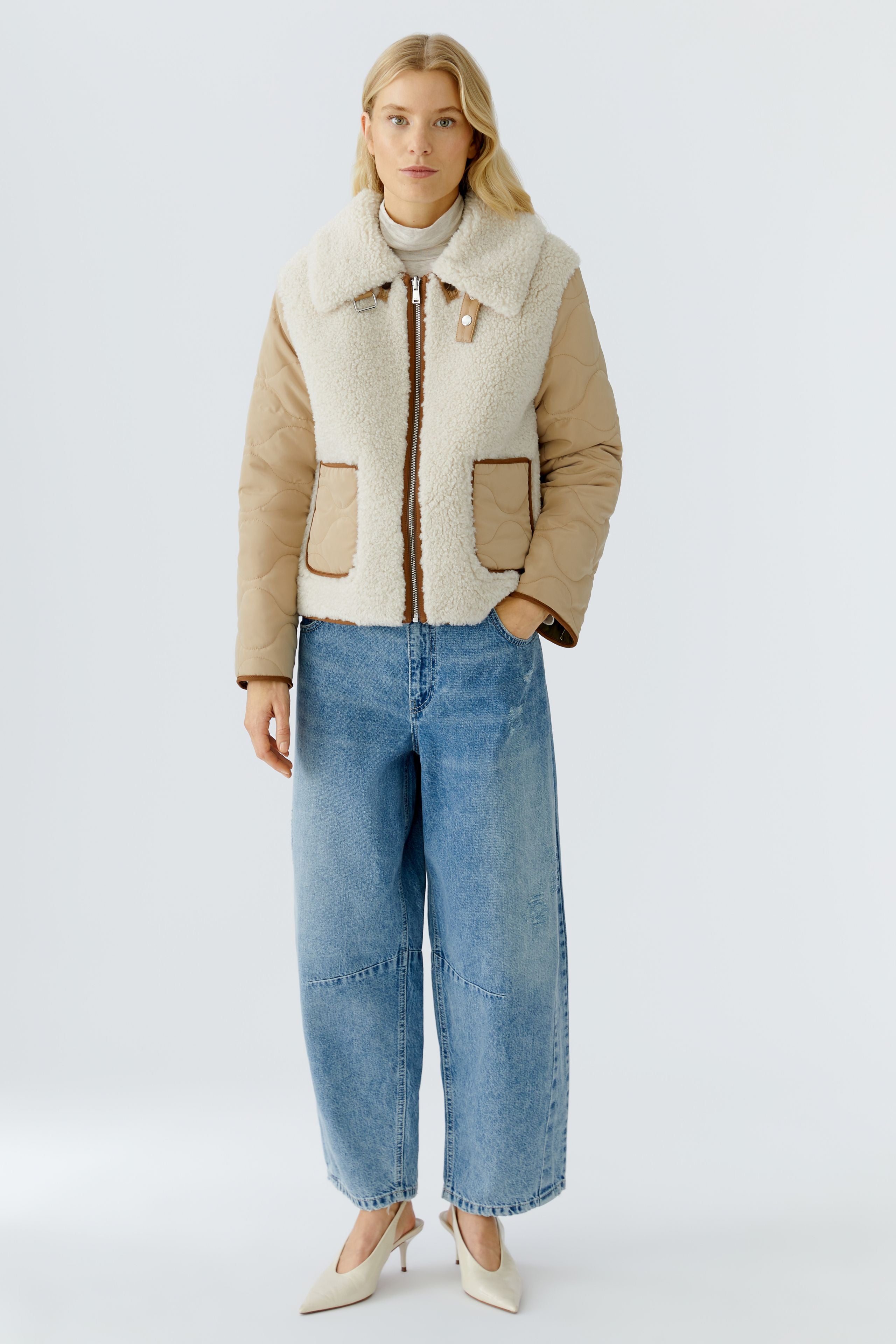 Oui reversible jacket — front view, ecru faux-shearling side with beige quilted sleeves.