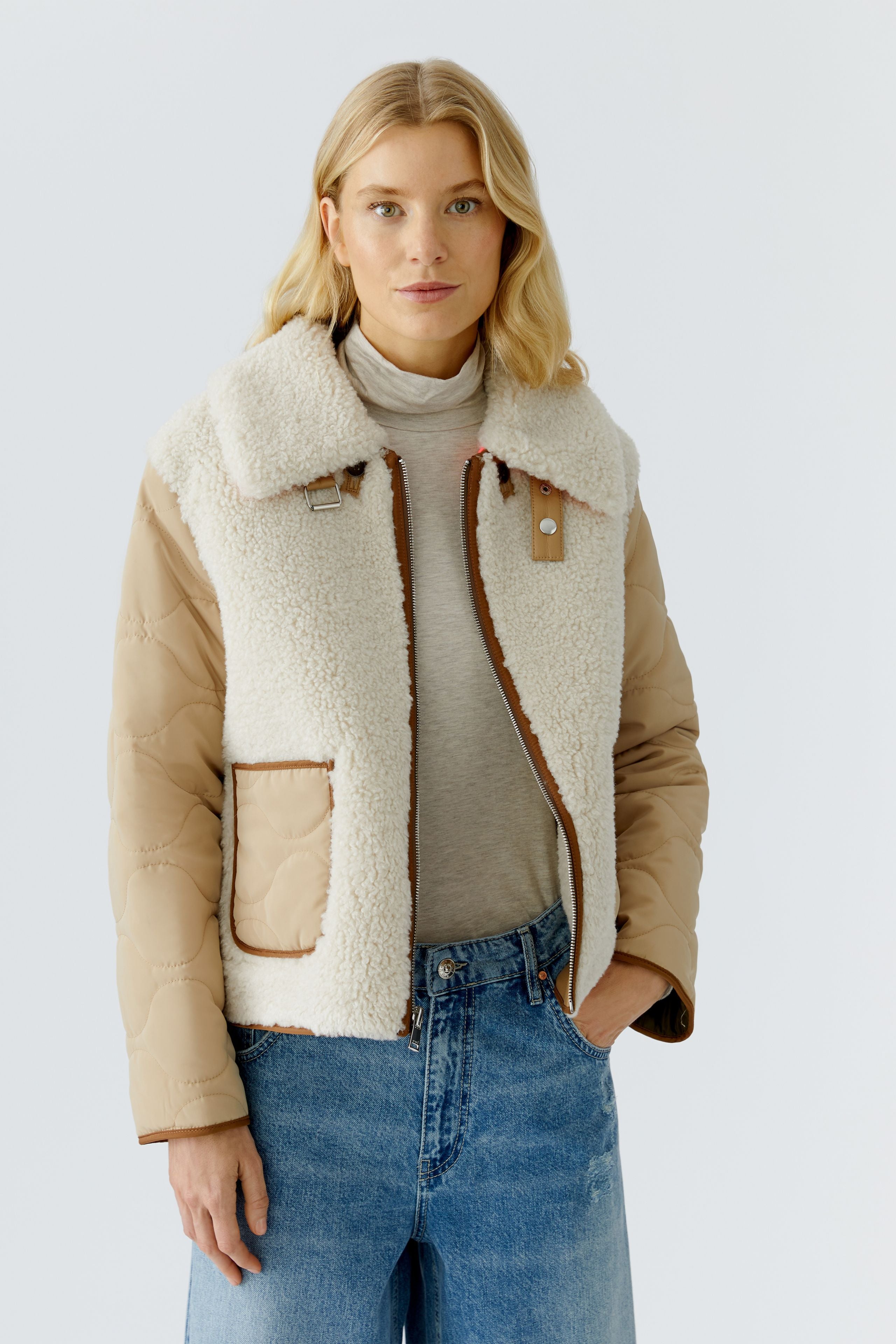Oui reversible camel women’s shearling style jacket with tan quilted sleeves and cream collar tab.