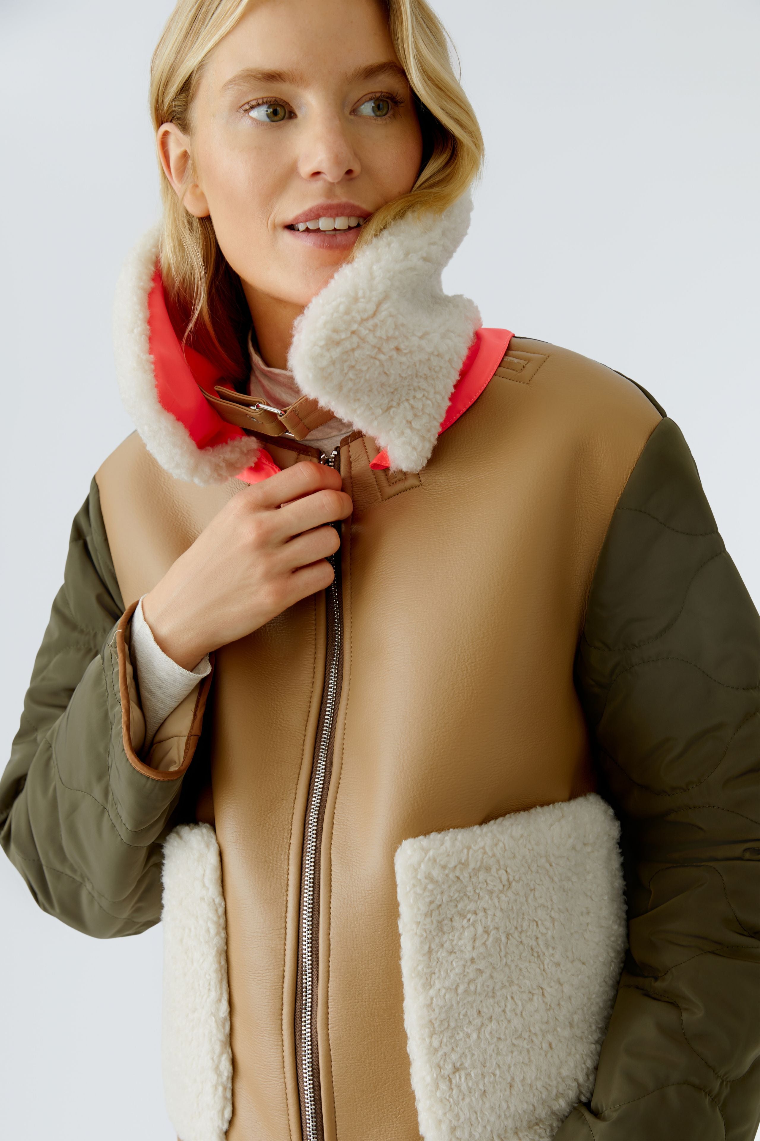 Oui reversible jacket — lifestyle image, tan side open to show shearling reverse collar.