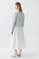 Back view of cropped sequin bouclé jacket by Oui