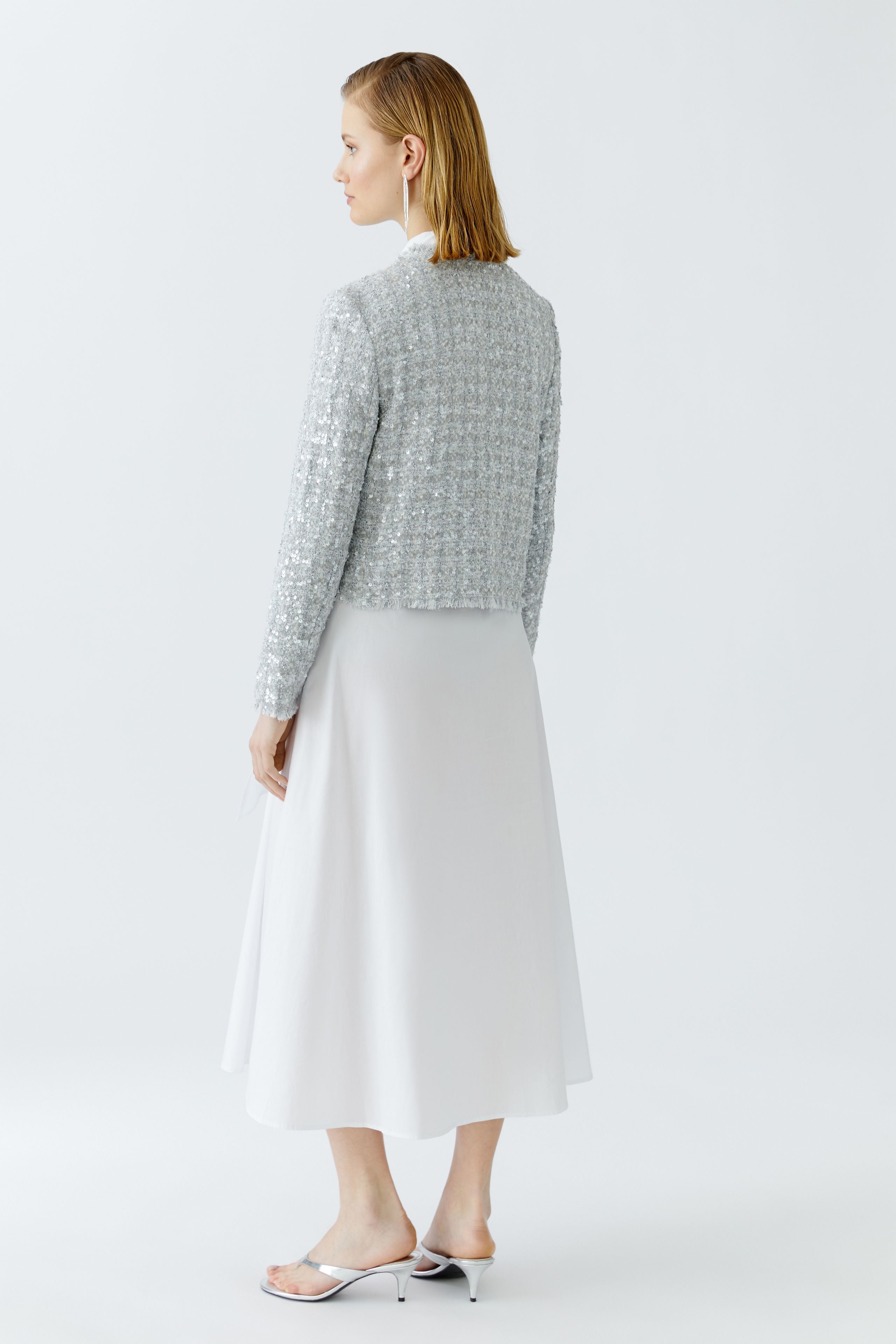 Back view of cropped sequin bouclé jacket by Oui