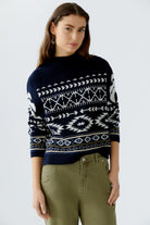 Model wearing Oui navy Norwegian jumper with cropped fit and jacquard knit