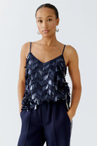 Oui glossy navy cami top styled front-on with hands in pocket