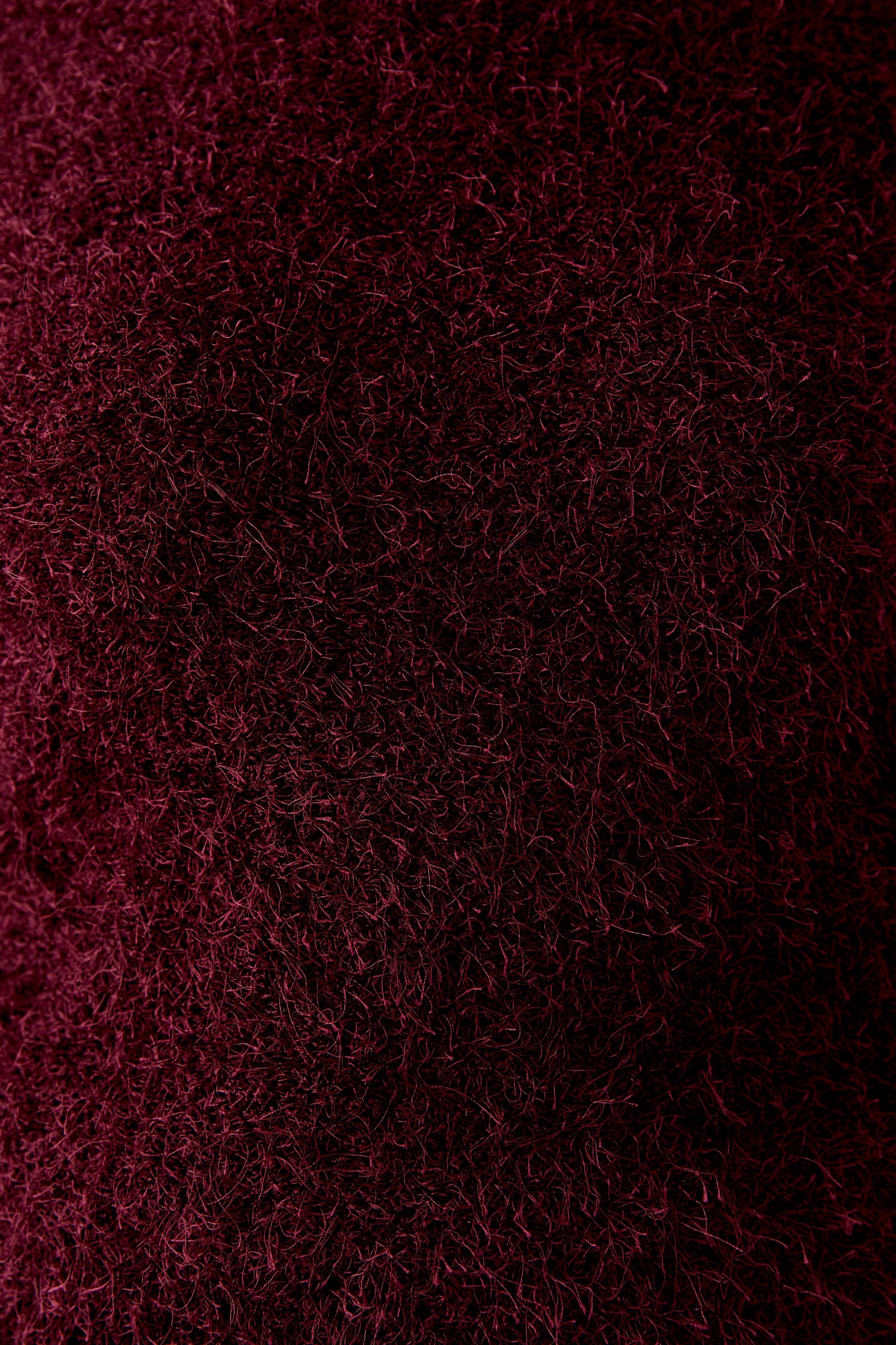 Close-up of cosy fluffy berry jumper from Oui