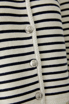 Detailed view of Oui cardigan buttons and textured knit trim
