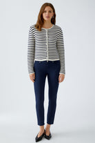 Model wearing Oui Marea navy and white striped cardigan with dark jeans