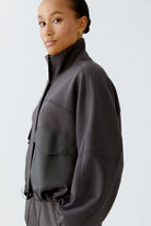 Side view of model showing jacket’s silhouette.