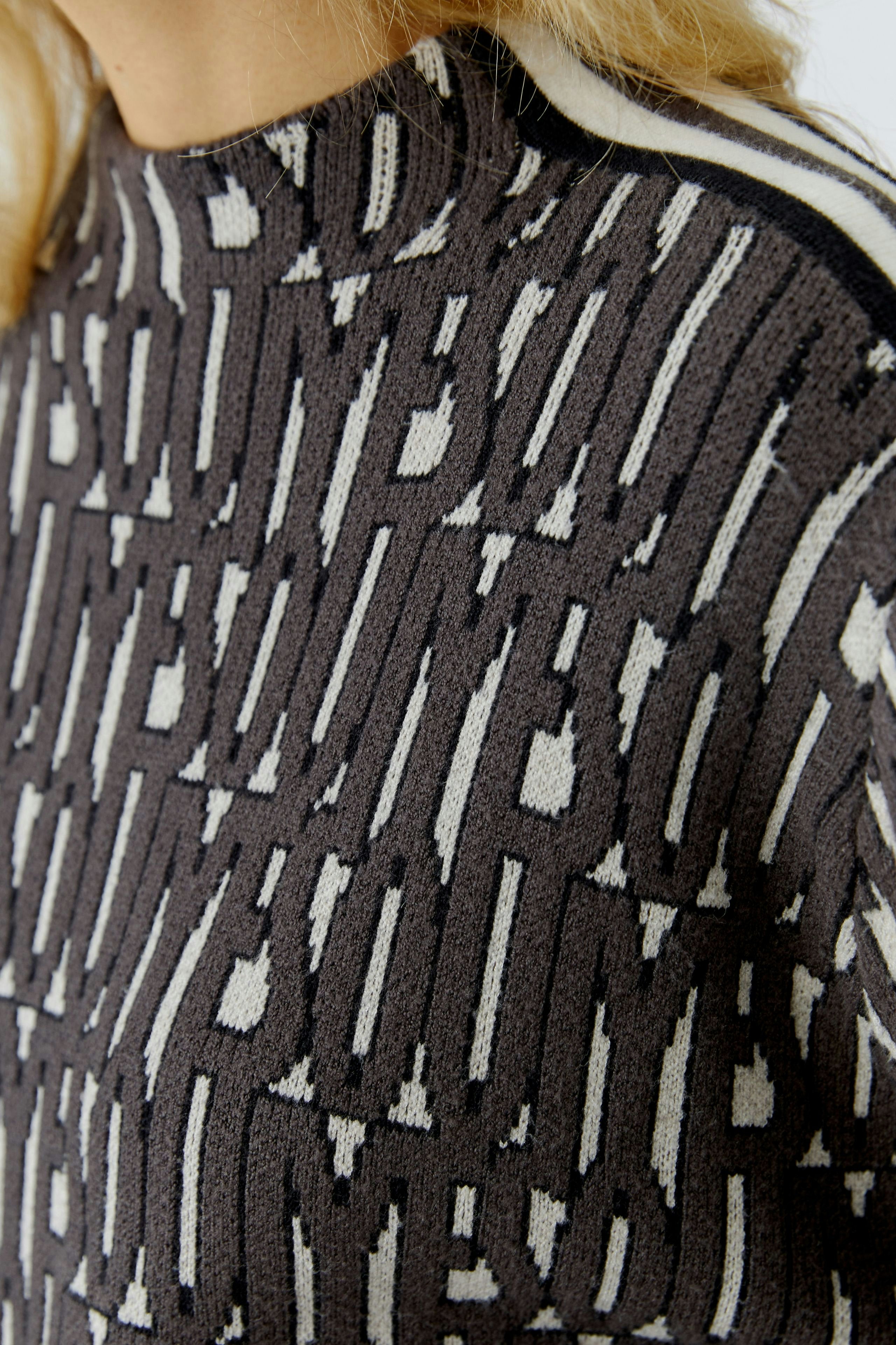 Close-up of Oui sporty knitted letter print jumper, showing jacquard knit pattern and short ribbed collar