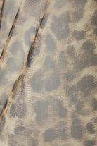 Oui tan leopard mesh top – flat lay of top with ruffle trim