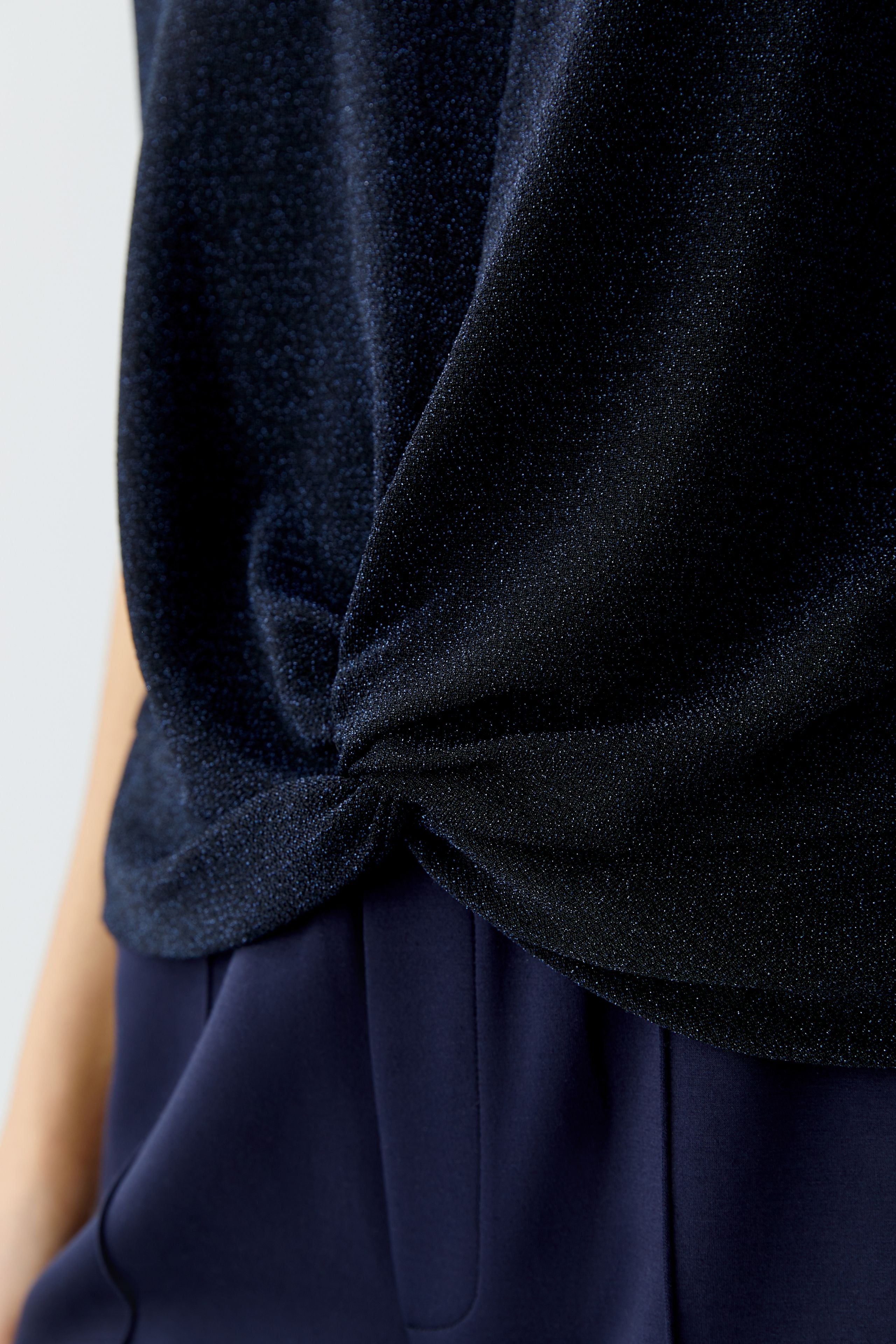 Detail of Oui soft metallic jersey fabric on twist top