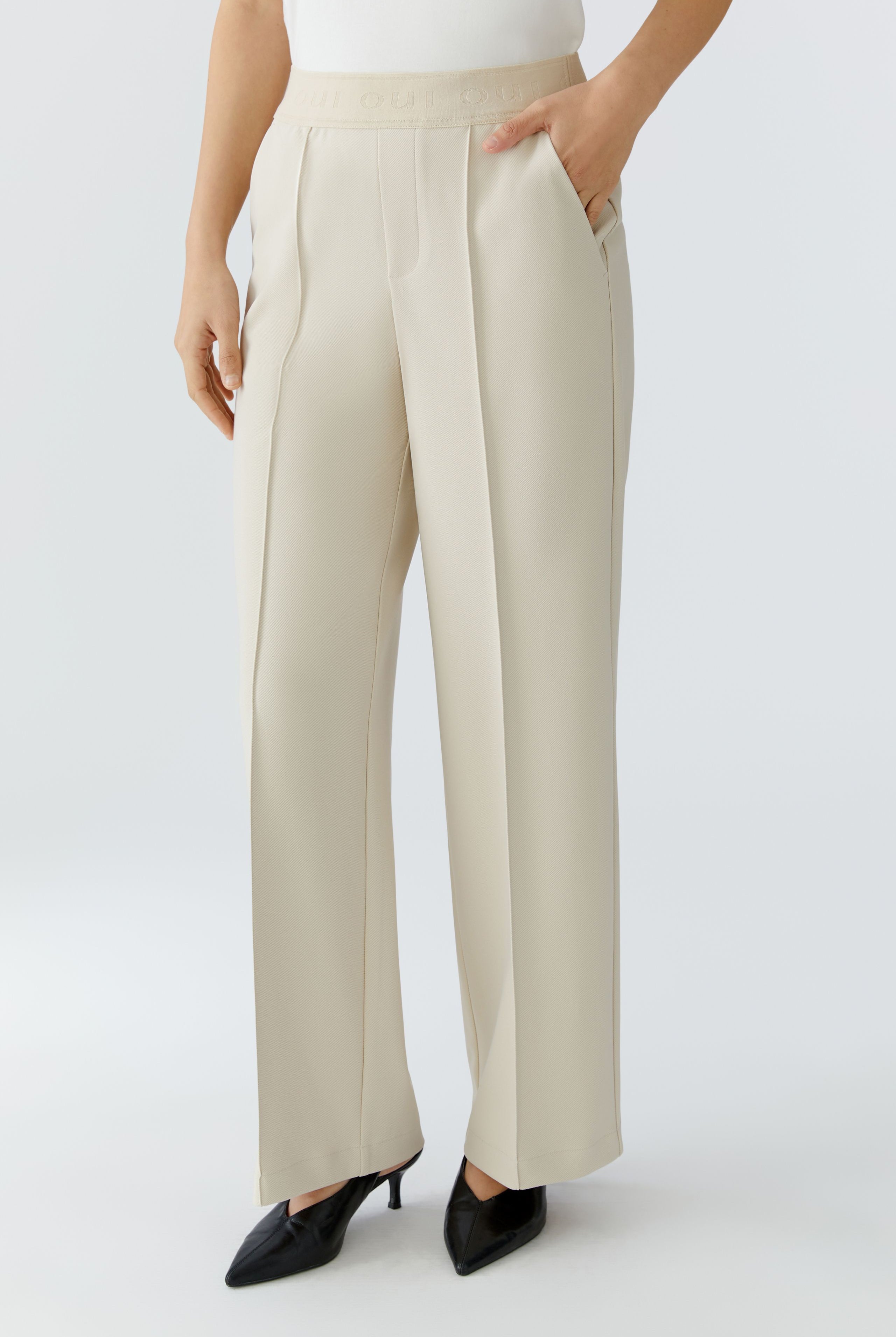 Oui beige technical jersey straight leg trousers front view