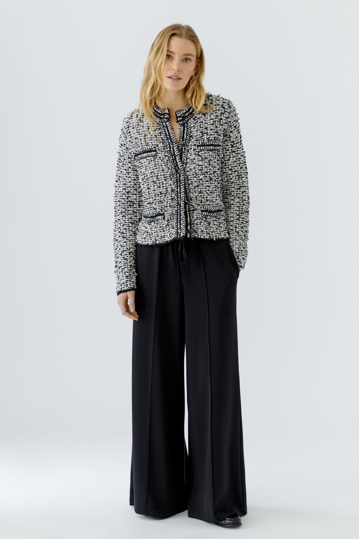 Oui black and off-white knitted jacket cardigan styled with black trousers