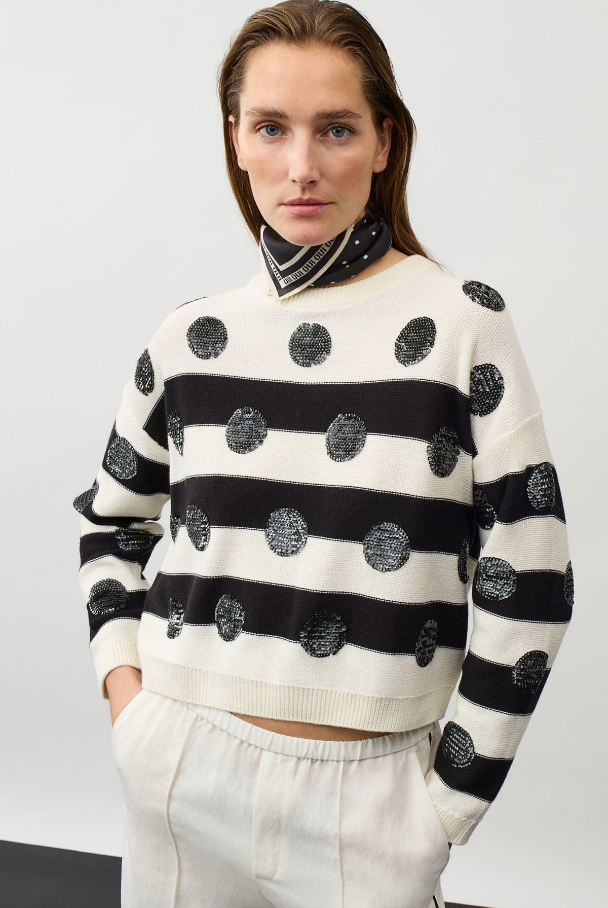 Oui black and white sequin stripe jumper styled with neck scarf – model view