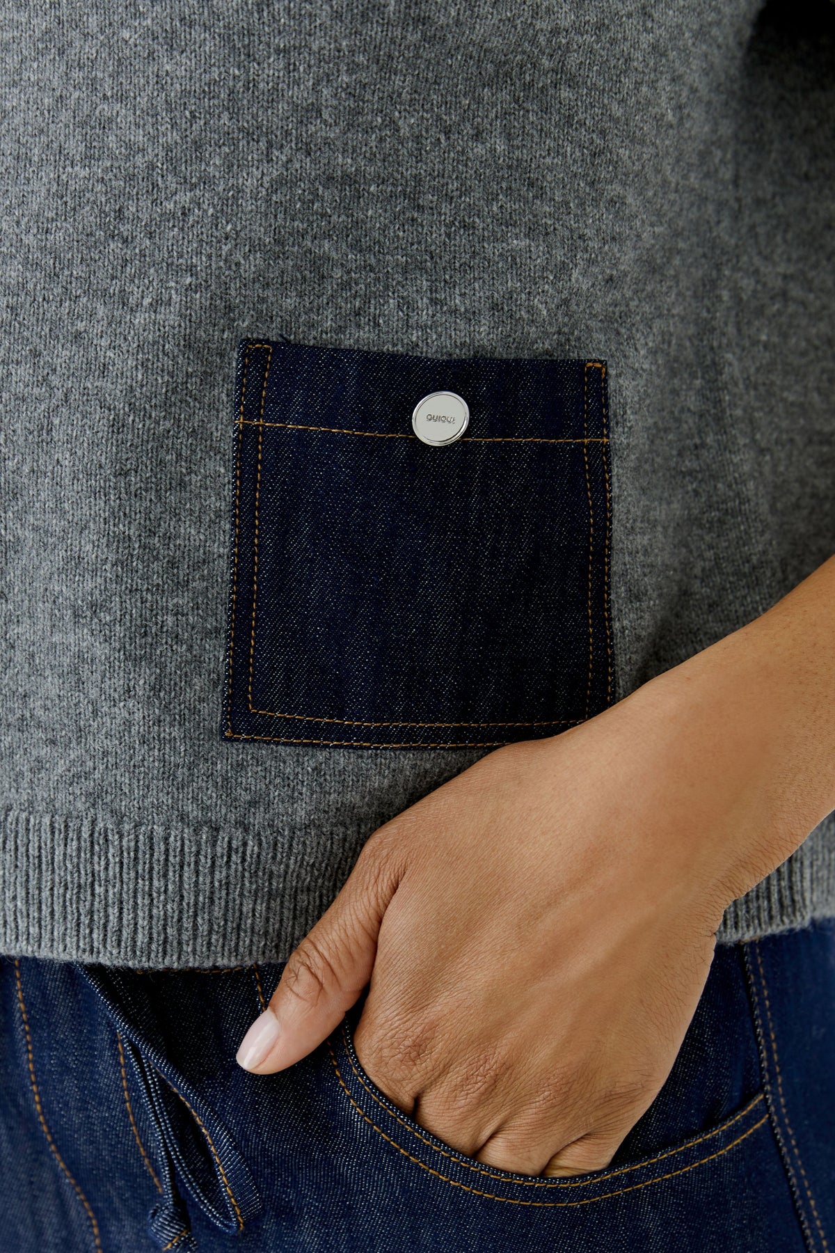 Oui grey jumper with dark denim pocket and silver-tone button – detail view