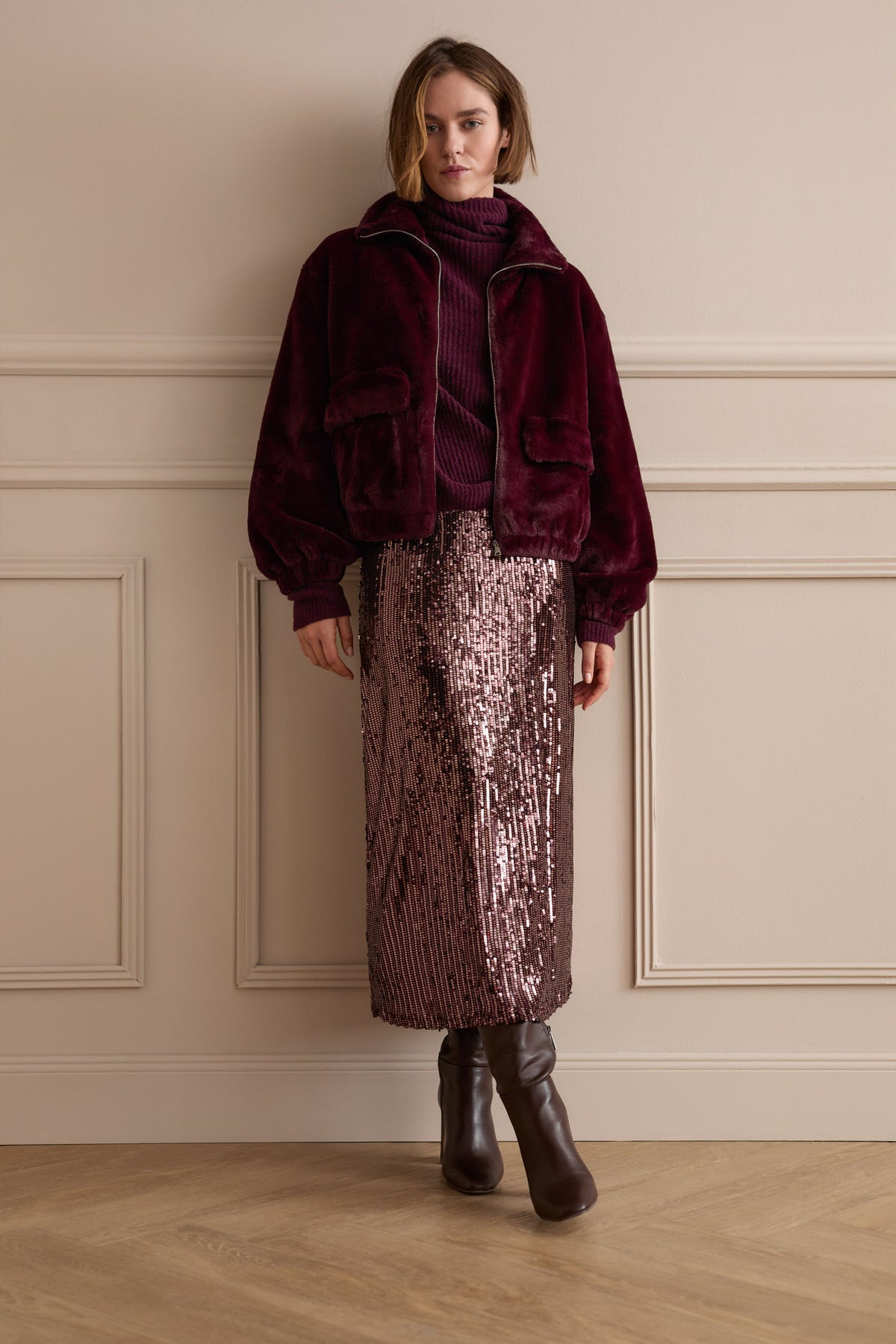 Oui burgundy roll neck jumper styled with tonal outerwear and sequin midi skirt – lifestyle view