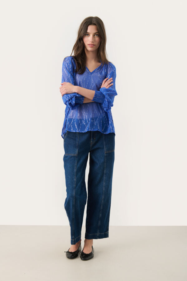 Full outfit with model wearing Part Teo Teia blue blouse and relaxed trousers