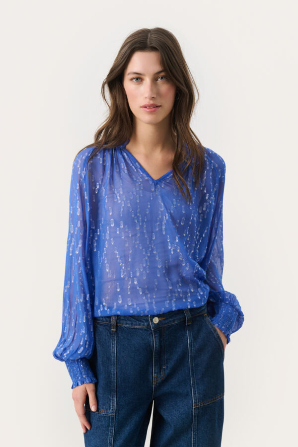 Model wearing Part Two Teia puff sleeve blouse in amparo blue