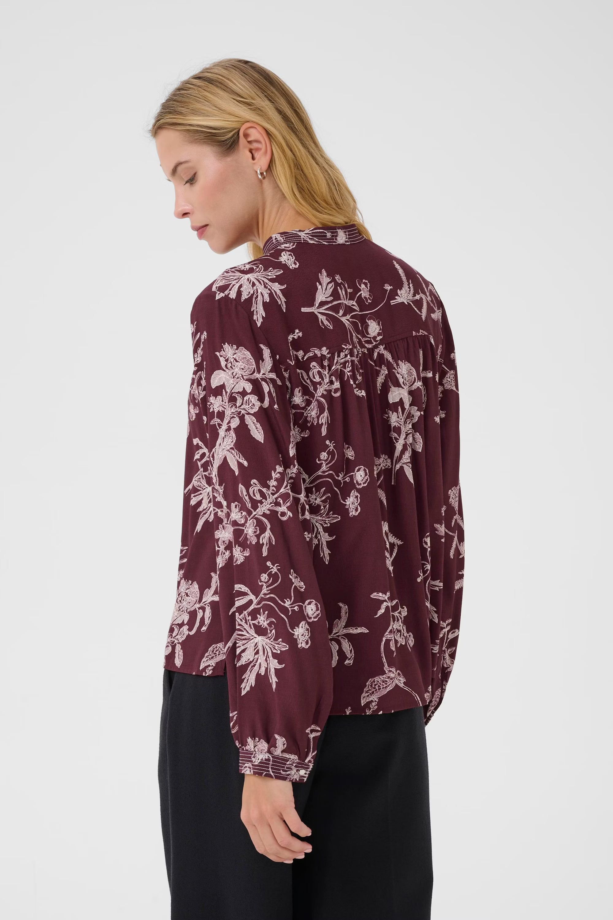 Back view of model wearing Shiroma burgundy floral blouse