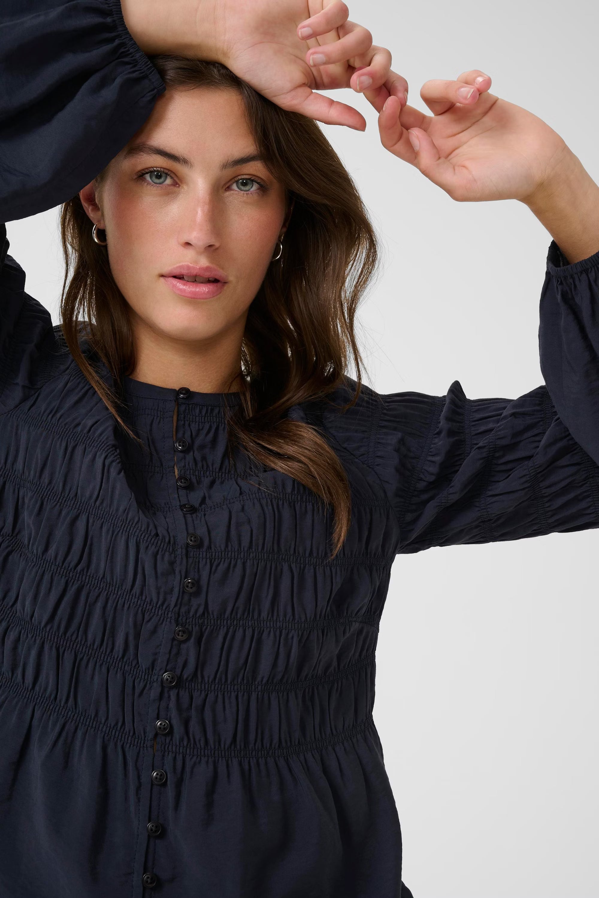 Close-up of button front on Part Two Siffe long balloon sleeve navy top