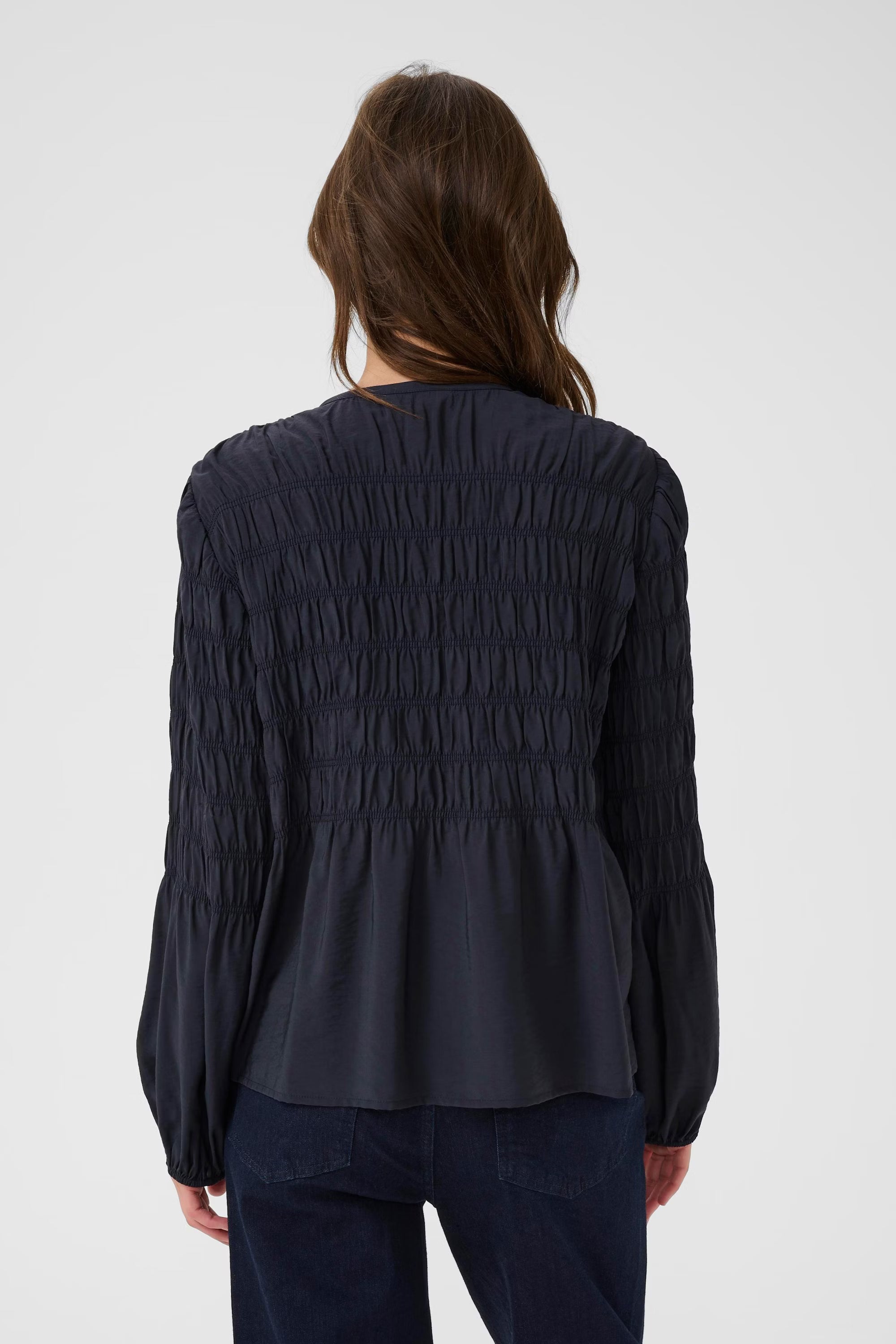 Back view of navy Part Two Siffe blouse with gathered sleeves