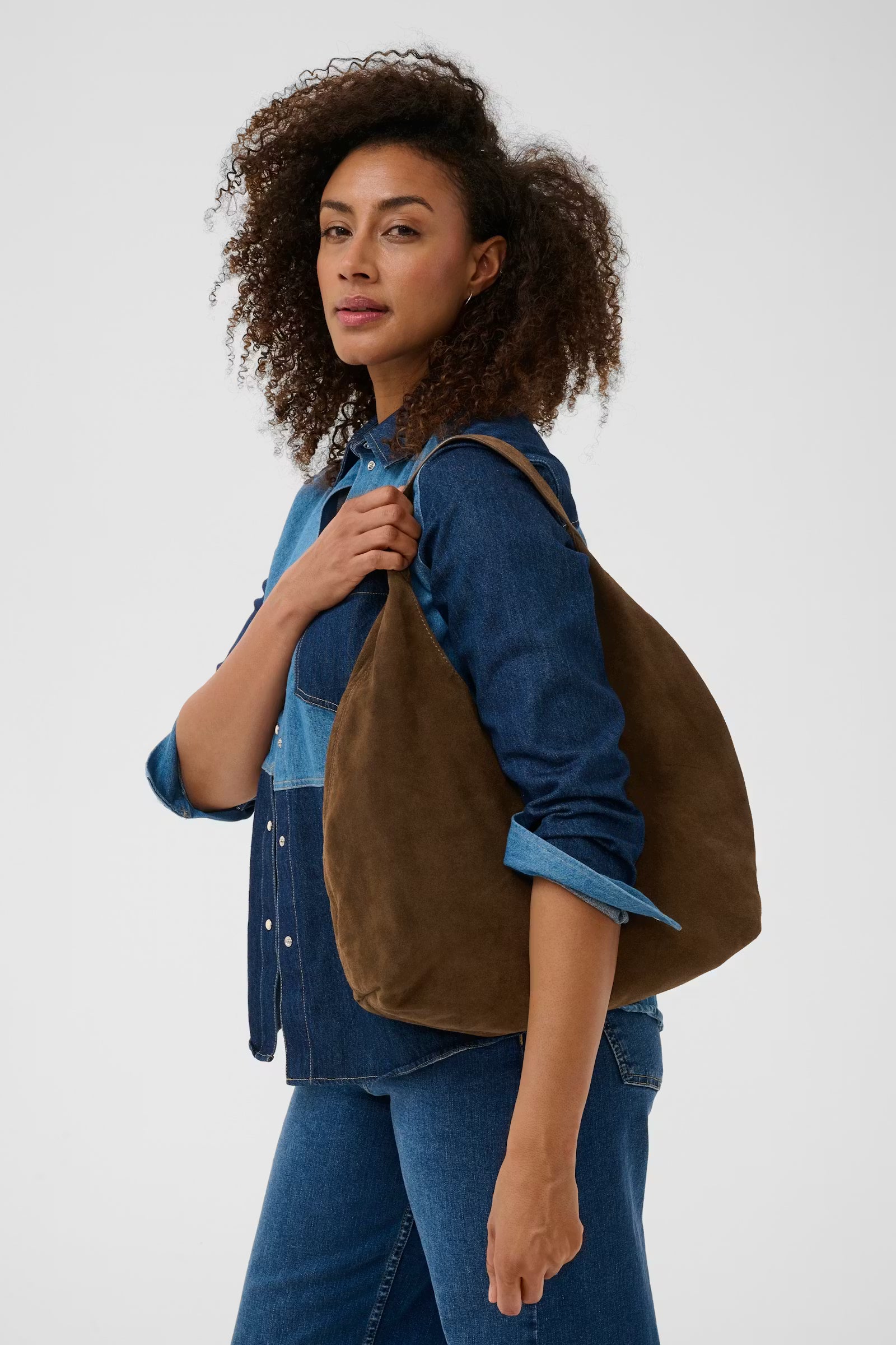 Part Two Athea brown suede shoulder bag styled with dark denim