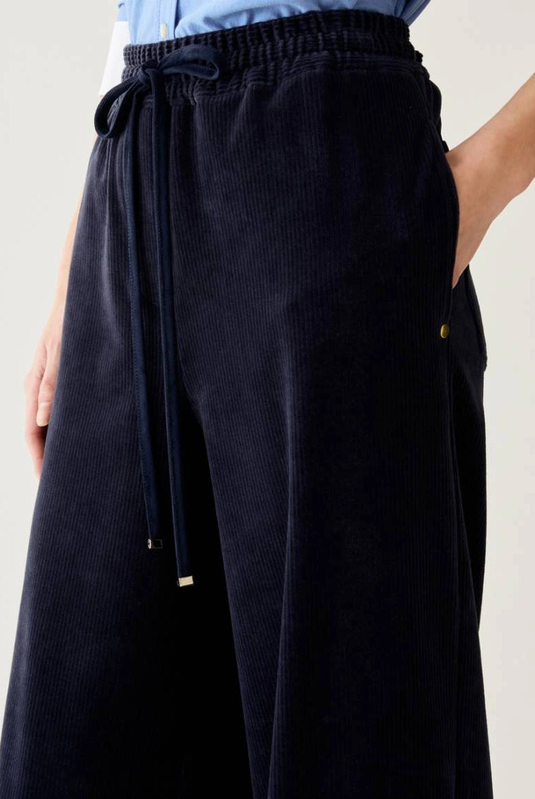 Pennyblack Vischio navy velvet jersey trousers showing drawstring waistband and side pocket – close-up