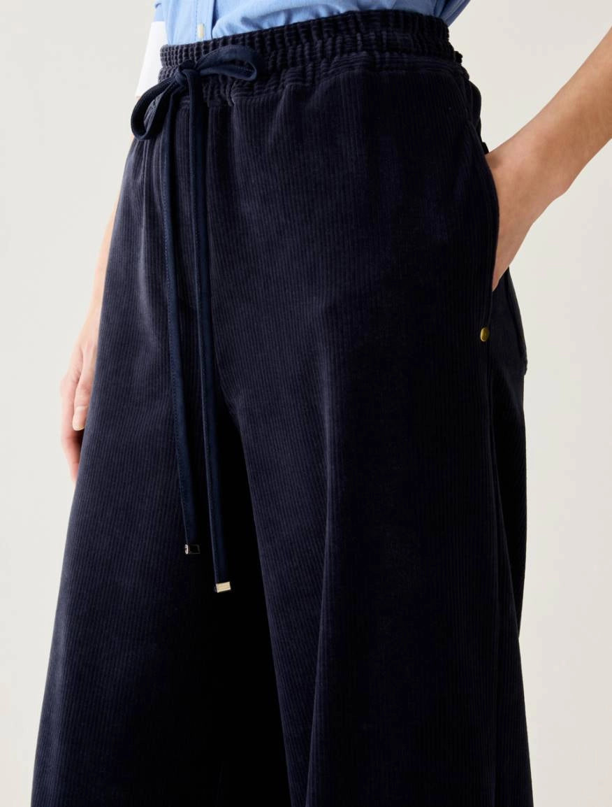 Pennyblack Vischio navy velvet jersey trousers showing drawstring waistband and side pocket – close-up